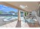 Covered patio with dining area overlooking the pool and yard at 2019 E Wahalla Ln, Phoenix, AZ 85024