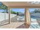 Covered back patio featuring tile flooring overlooking a pool and yard at 2019 E Wahalla Ln, Phoenix, AZ 85024