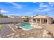 Well-maintained backyard featuring a swimming pool and desert-style landscaping at 2019 E Wahalla Ln, Phoenix, AZ 85024