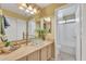 Bathroom with a glass bowl sink, decorative mirror, and shower-tub combination at 2019 E Wahalla Ln, Phoenix, AZ 85024