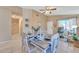 Bright dining area showcasing a beautifully decorated table with seating for six, adjacent to the entry and living spaces at 2019 E Wahalla Ln, Phoenix, AZ 85024