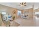 Bright dining area with tile flooring, a cozy armchair, and a beautifully set table near a window at 2019 E Wahalla Ln, Phoenix, AZ 85024