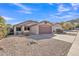 A single-story home with a two-car garage and desert landscaping at 2019 E Wahalla Ln, Phoenix, AZ 85024