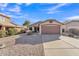 Charming single-story home with a two-car garage and low-maintenance landscaping in a sunny neighborhood at 2019 E Wahalla Ln, Phoenix, AZ 85024