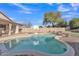 Backyard featuring pool with a basketball hoop and a beautiful tree with green foliage at 2019 E Wahalla Ln, Phoenix, AZ 85024