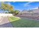 Picture of a custom backyard putting green bordered by stone and low decorative brick at 2019 E Wahalla Ln, Phoenix, AZ 85024