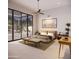 Stunning main bedroom with a desert landscape view, a ceiling fan, and modern decor at 2075 N Holmes Rd, Apache Junction, AZ 85119