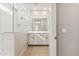 Modern bathroom features a double vanity with white cabinetry and a tiled walk-in shower at 21208 N 58Th St, Phoenix, AZ 85054