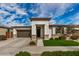 Charming single-story home featuring a well-manicured lawn, inviting entrance, and a two-car garage at 22864 E Via Del Sol --, Queen Creek, AZ 85142