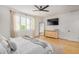 Bright main bedroom features a ceiling fan, lots of natural light, and a decorative dresser at 22864 E Via Del Sol --, Queen Creek, AZ 85142