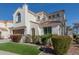 Beautiful stucco home showcasing manicured landscaping, a red tile roof, and charming architectural details at 2300 W Sunrise Pl, Chandler, AZ 85248