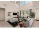 Soaring ceilings and large windows fill this stylish living room with natural light at 2300 W Sunrise Pl, Chandler, AZ 85248