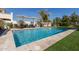 Inviting pool area with lounge chairs, shade umbrellas, and well-maintained landscaping at 2300 W Sunrise Pl, Chandler, AZ 85248