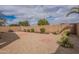 Backyard featuring stone ground cover and a block perimeter fence at 233 N 21St St, Coolidge, AZ 85128