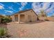 Landscaped backyard with gravel, decorative stone, and privacy walls at 233 N 21St St, Coolidge, AZ 85128