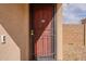 Close-up of the front door with secure screen door and modern smart doorbell at 233 N 21St St, Coolidge, AZ 85128