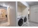 Convenient laundry closet with stacked washer and dryer hookups, and built in shelving at 233 N 21St St, Coolidge, AZ 85128