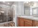 Bathroom featuring a glass shower with a seat and modern vanity at 24027 N 164Th Dr, Surprise, AZ 85387