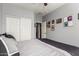 Bedroom featuring a double closet, ceiling fan and comfortable bed at 24027 N 164Th Dr, Surprise, AZ 85387