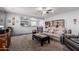 Inviting living room with neutral tones, comfortable seating, and open layout to the adjacent kitchen area at 24027 N 164Th Dr, Surprise, AZ 85387