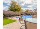 Backyard featuring a private pool, patio space, and dining area at 24027 N 164Th Dr, Surprise, AZ 85387