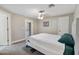 Cozy bedroom with neutral tones, a ceiling fan, and sliding glass door to the outside at 2709 E Clarendon Ave, Phoenix, AZ 85016