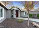 Charming home featuring a red front door, xeriscaped front yard and exterior wall lighting at 2709 E Clarendon Ave, Phoenix, AZ 85016