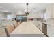 Spacious kitchen with a large island featuring quartz countertops and modern pendant lighting at 2709 E Clarendon Ave, Phoenix, AZ 85016