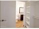 Bathroom with toilet and sink, visible from the open door next to a closet with shelving at 2959 N 68Th Pl # 112, Scottsdale, AZ 85251