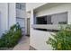 Condo exterior with a private front walkway and beautiful desert landscaping at 2959 N 68Th Pl # 112, Scottsdale, AZ 85251