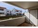 Condo patio with white door and views of adjacent buildings and landscaped greenery at 2959 N 68Th Pl # 112, Scottsdale, AZ 85251