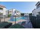 Community swimming pool area featuring lounge chairs and shade trees surrounded by condos at 2959 N 68Th Pl # 112, Scottsdale, AZ 85251