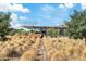 Exterior shot of a building featuring modern architecture, natural landscaping, and clear signage at 3006 E Agritopia N Loop, Gilbert, AZ 85296