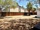 Expansive backyard featuring a privacy fence and shaded area from mature trees. Ready for outdoor activities at 3322 E Willetta St, Phoenix, AZ 85008