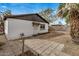 Backyard featuring a detached garage, a patio and mature tree at 3322 E Willetta St, Phoenix, AZ 85008