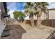 Backyard featuring a detached garage, a patio and mature trees at 3322 E Willetta St, Phoenix, AZ 85008