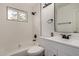 Clean bathroom featuring subway tile, new fixtures, and a shower-tub combination at 3322 E Willetta St, Phoenix, AZ 85008