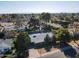 Aerial view of a home featuring mature trees and backyard pool in a residential neighborhood at 3511 E Elm St, Phoenix, AZ 85018