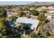 Aerial view of a home featuring a pool and lush backyard landscape, with distant mountains at 3511 E Elm St, Phoenix, AZ 85018