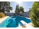 Backyard swimming pool featuring a diving board and refreshing blue water at 3511 E Elm St, Phoenix, AZ 85018