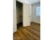 Bedroom showcasing a closet, laminate flooring, and a window with blinds at 3810 N Maryvale Pkwy # 1068, Phoenix, AZ 85031