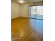 Living room with tile flooring and sliding glass door with window coverings at 3810 N Maryvale Pkwy # 1068, Phoenix, AZ 85031