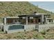 Stunning modern home with desert landscaping, pool, outdoor kitchen and open-air terraces on a hillside setting at 39347 N Old Stage Rd, Cave Creek, AZ 85331