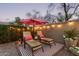 Charming backyard featuring lounge chairs, string lights, and desert landscaping for ultimate relaxation at 4216 E Desert Marigold Dr, Cave Creek, AZ 85331