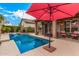 Relaxing backyard pool area with water feature and shaded patio for outdoor enjoyment at 4216 E Desert Marigold Dr, Cave Creek, AZ 85331