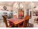 Elegant dining room with a chandelier and an adjacent view of the kitchen at 4216 E Desert Marigold Dr, Cave Creek, AZ 85331