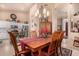 Charming dining room with a wooden table and a view of the kitchen at 4216 E Desert Marigold Dr, Cave Creek, AZ 85331