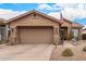 Charming home with desert landscaping, including cacti, and a front-facing two-car garage at 4216 E Desert Marigold Dr, Cave Creek, AZ 85331