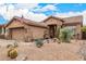 Charming home exterior with desert landscaping and native cacti in the front yard at 4216 E Desert Marigold Dr, Cave Creek, AZ 85331