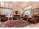 Spacious living room featuring a large decorative rug and ample seating at 4216 E Desert Marigold Dr, Cave Creek, AZ 85331